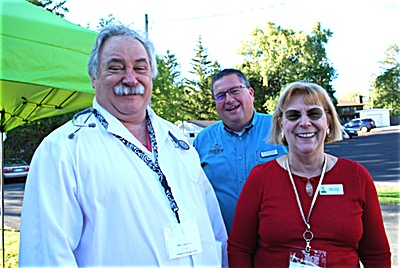 Dr. Radomir Stevanovic and Sue Penny from Ithaca Primary Care (front) and Dr. Ted Bryant of Clarity Eye Care (center). Photos by Karen Veaner Doctors