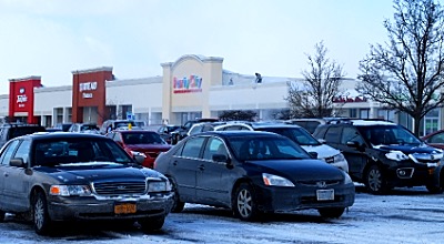 Workers blow and shovel snow off the Cayuga Mall roof to relieve the pressure from the weight of recent storms cmroof roof