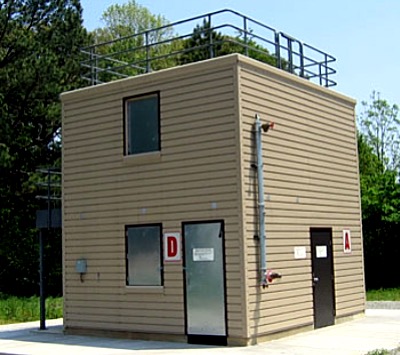 The training tower manufactured by Fire Facilities includes burn room on the first floor includes insulation and temperature monitoring, stairs , ladders and a balcony, plus roof features that allow training in real fire conditions. fire trainingtower volunteer2