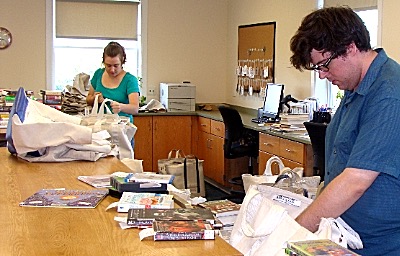 Workers sort books borrowed from some libraries to send out for inter-library loan to other libraries within the system FLLS