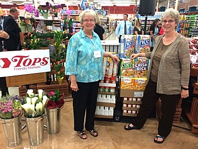 Nancy Myers (left) receives a palette of food for the Lansing Food Pantry with Paster Jane Sauter fptops nancy