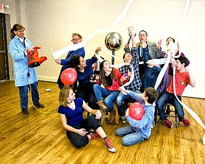 (from left to right) Standing - Erik Herman, Lora Hine, Joey Steinhagen, Lesley Greene. On stools - Caitlin Mallory, Erin Hilgartner, Christian Henry, Elisheva Glaser, Imri Leshed. On the floor - Kayla Markwardt, Lucian Mead-VanCort. Photo: Dave Burbank kitchen physicsfair