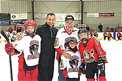 Three generations of Sciarabbas participated in the ceremonial puck drop to start the new season for FLRHA's Peewee hockey season. Jay (in Black), Andy (to Jay's right) and Dane (center) Sciarabba. Photo courtesy of Jay Sciarabba Puck Drop