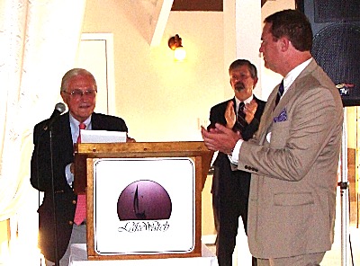 Roy Park (left) was named Republican Of The Year in a plaque presented by Mike Sigler (right). Ed LaVigne (center) moderated the evening's presentation. Park, LaVigne, Sigler