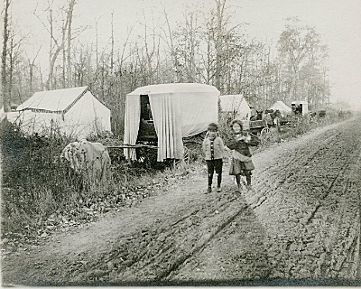 A gypsy camp across the street from Charles Bower, Jr.'s property on Ridge Road (34B). The photo was taken near the top of the hill travelling north on NYS Route 34B after a bridge that spans Salmon Creek. Today the location is filled with apartment buildings. Gypsy Camp in lansing, NY