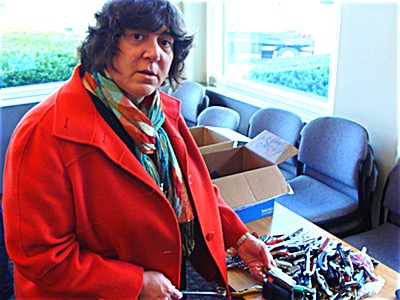 TSA Public Affairs Manager Lisa Farbstein with boxes of surrendered contraband Lisa Farbstein