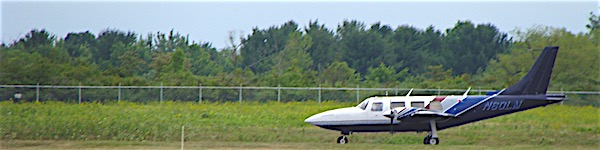 Larry Baum makes the first landing Saturday in his six-seat Aerostar when the runway reopened after two weeks of repaving Runway Reopens