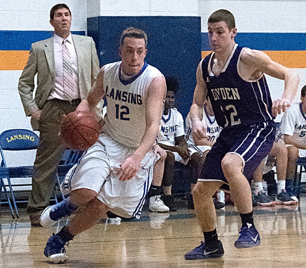 Tanner Winslow driving past a Dryden defender. Photo by Bruce Barber basketball brb 20161221 1374 0578