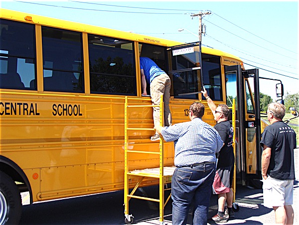 Bus drivers practice emergency procedures as part of an eight hour training session Tuesday. New York State requires two hours of training twice a year. Lansing drivers spent the day training Tuesday, and will attend another session in January. Bus Driver Training