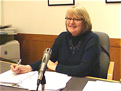 Debbie Crandall taking notes Wednesday for the minutes of her last Town meeting as Clerk Debbie Crandall