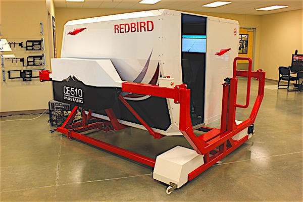 Chief Pilot instructor and Club Manager Mike Hall hopes to be able to aquire a full motion simulator once the new building is completed. Photo courtesy of Redbird Flight Simulations, Inc. East Hill Flying Academy
