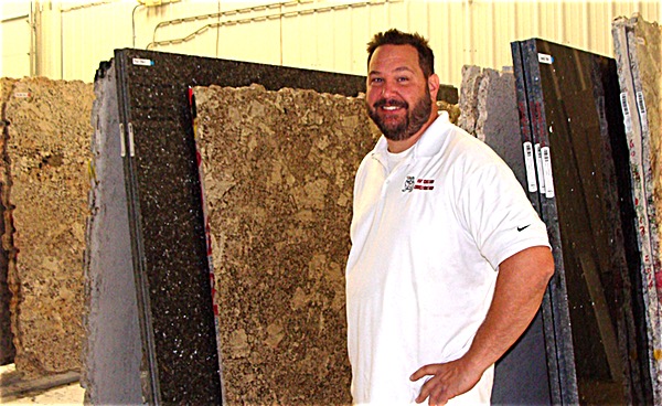 F & F Custom Construction owner Marty French. Currently there are about 100 surfaces to view in the new store, but more truckloads continue to come from Endicott delivering more slabs for customers to choose from. F & F Custom Construction