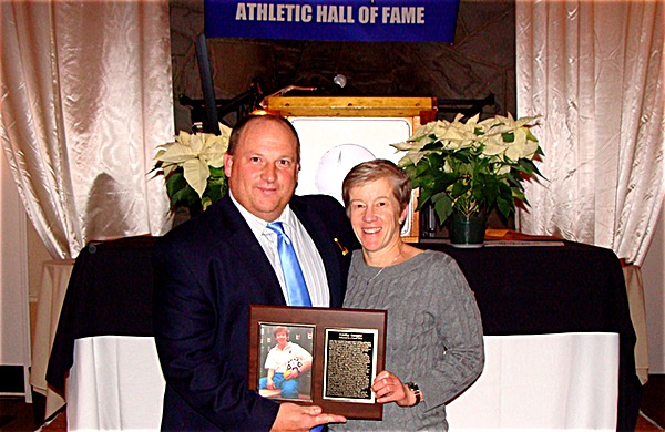 Adam Heck served on the Lansing Athletics hall of Fame Committee. Here he is pictured inducting Cathy Haight, a successful three sport coach in Lansing -- Girls' Soccer, Girls' Volleyball and Softball -- into the Hall of Fame 'Class of 2004'. Adam Heck at Athletics Hall of Fame Induction
