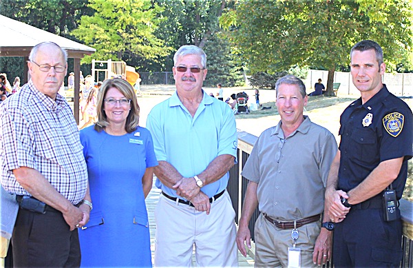 Left to Right: Ron Nesbitt, Supervisor Town of Webster; Pam Helming; Barry Deane, Webster Town Board Member; Mark Yaeger, Commissioner of Webster Parks and Recreation; and Lieutenant Brad Fosdick, Webster Police helming whistlestopannouncement