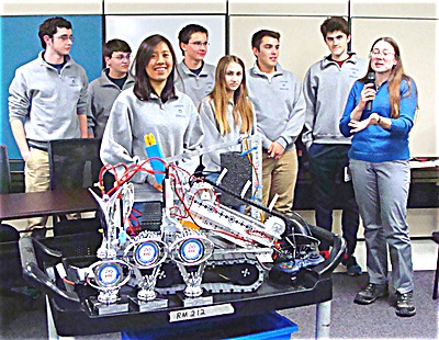 The 2015-16 Lansing Robotics team and its advisor, high school physics teacher Andrea Schneider (right) attended the Board Of Education meeting Monday to show the Board their robot and talk about this year's achievements lansingrobotics team400