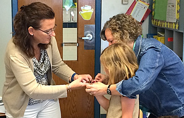 A second grader tagging a Monarch butterfly. Monarch Butterfly