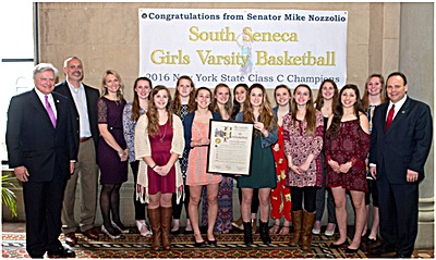 Front Row left to right: Morgan McGonigal, Elisia Panipinto, Sarah Albro, Hannah Podgorny, and Skyler Shaulis. Back Row left to right: Senator Mike Nozzolio, Assistant Coach Bob Mott, Head Coach Heather Mott, Mary Kate Badalamenti, Jade Parsons, McKenzie Kenyon, Kelsey Shaulis, Bailey Minges, Laura Wyckoff, Emily Lavarnway, and Assemblyman Phil Palmesano nozzolio ss team