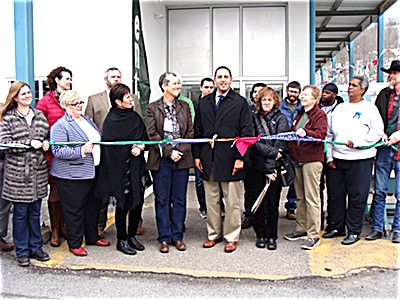 ReUse Center Executive Director Diane Cohen and Ithaca Mayor Svante Myrick (center) were joined by employees and supporters for an official ribbon cutting at the Elmira Road location a few weeks ago. Ithaca ReUse Center
