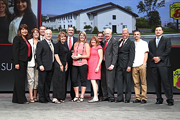 Left to right: Alice Lazore, Vice President, Brand Operations; Linda Lofink, CFO, David Chugg, Senior Director of Franchise Operations, Mike Mueller, Brand Senior Vice President, Cathy White,Secretary, Jeffery Nolan, Regional Director of Franchise Operations, Julie Swigart, General Manager of the Year, Marybeth Majestic, Secretary, Marc Devitt, F. Edward Devitt, Owner, Tom Spraque, Zach Swigart, and Greg Mankala, DFO. super8ithaca