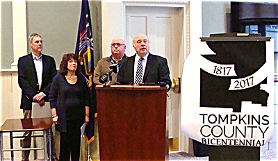 Tompkins County Legislature Chair Michael Lane (at podium) announced Thursday that 2017 will be celebrated as Tompkins County's 200th anniversary. He was joined by fellow commission members (left to right) History Center Director Rod Howe, Tompkins County Public Information Officer Marcia Lynch, and Commission member Ray Wheaton tc anniversaryannouncement400