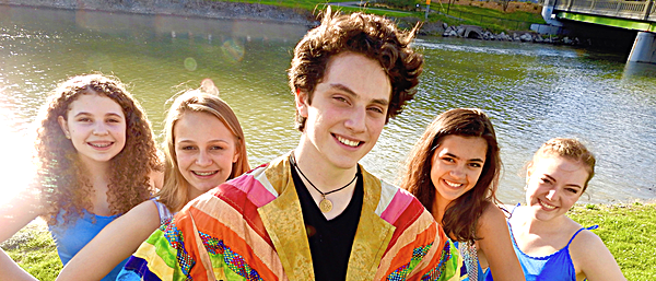 Jasper Fearon (center) as Joseph, with the Narrators (left to right) Dani Copeland, Addy Whitener, Elsbeth O’Toole, and Madelyn Kilmer R2P JosephPublicityPhoto3