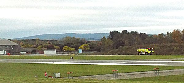 The Airport Fire Department Responds, speeding along taxiways to the disaster drill site Airport Fire Department Responds