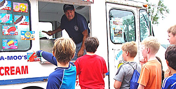 Nick Pidlypchack handing out ice cream to Lansing Rec campers last Friday Lansing Rec Camp and Ice Cream