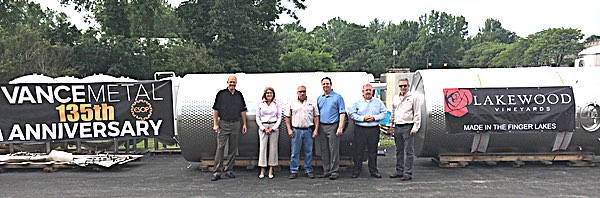 Senator Pamela A. Helming toasts to three new 2,500-gallon stainless steel tanks that Geneva-based Vance Metal Fabricators Inc. manufactured for Lakewood Vineyards in Watkins Glen Thursday, July 20, 2017 with Vance Metal staff during a tour of the large-capacity metal fabricator and weld shop. From left to right are Vice President Chris Jennings, Senator Helming, John Sabin, Pat Farrington, Bill Snyder, and Jerry Crabtree. helmingToasttheTanks