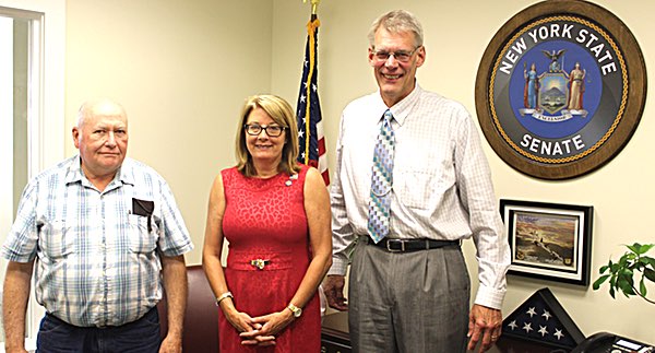 Senator Pam Helming meets with New York Farm Viability Institute Secretary/Treasurer Jim Fravil, left, and New York Farm Viability Institute David Grusenmeyer, right, at her District Office in Geneva. helming invasivespecies