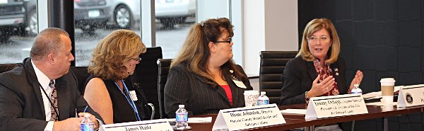 Helming participates in the conversation during her roundtable discussion on the heroin and opioid addiction crisis at Generations Bank in Seneca Falls. helming opiod panel