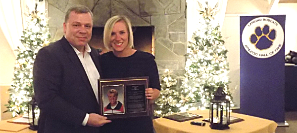 Danielle Smith is presented her plaque by brother Richard Smith Danielle Smith