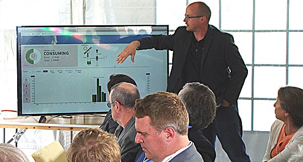 18 solar panels produced 4,500 watts for the official announcement of the 18 megawatt Cayuga Solar array. A large screen to one side of the audience monitored the portable solar array's output during the event. QuikSolar Solar Powered Press Conference