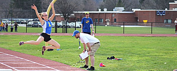 Emily Gallagher setting the new Lansing school record in the long jump. Photo by Steve Kuramoto track EM LJ
