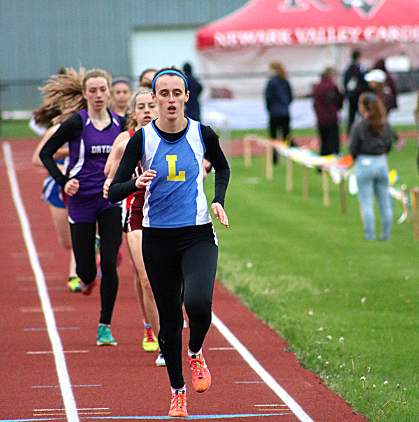 Freshman Catie Eisenhut leading the 1500m race. Photo by John Lawrence Catie Eisenhut