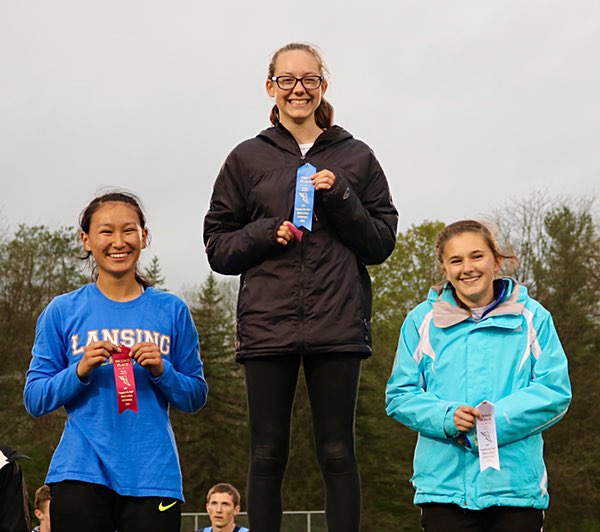 (Left to right) Junior Miya Kuramoto, senior Emily Gallagher, and junior Meghan Matheny swept the pole vault with their top three finishes. Photo by John Lawrence Pole vault
