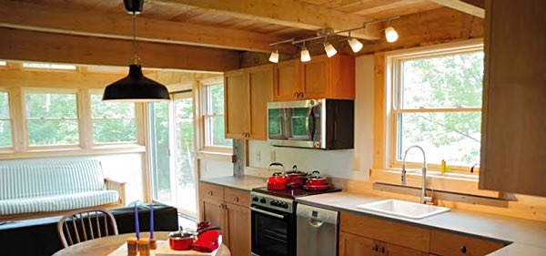 Homes are timber framed with many wood finishes inside and outside, and some traditional dry wall finishes on the inside. Details include bamboo flooring, some stone flooring, stone counter tops, lighting, and wood ceilings. All photos and maps courtesy of STREAM Collaborative. Tiny Timbers Interior