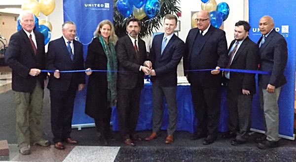 A ribbon cutting was part of the celebration Monday as the Ithaca Tompkins Regional Airport began offering all-jet service from the airlines -- Delta, United, and American -- that service the facility. Left to right: Mike Hall, Airport Director; Ewan Barr, Lansing resident, Air Service Consultant; Anna Kelles, County Legislator; Michael Stamm, President Tompkins County Area Development; Kevin Keado, Senior Regional Manager, United Airlines; J.W. Jones, VP Field Stations, Delta Global Services, and contract ground handling for United; Tom Harris, General Manager, Delta Global Services; Dr. Tony Cal, Station Manager, Delta Global Services United Jet Service ribbon cutting