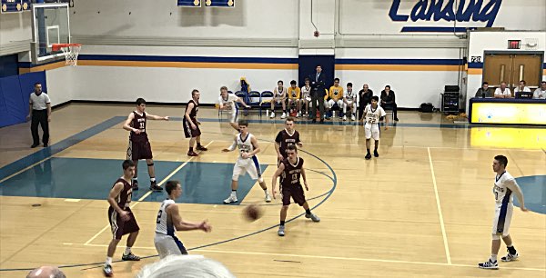 Miller LaBar pass to Winslow against Whitney Point. Photo by Christine Rebera basketball Miller LaBar pass to Winslow against WP