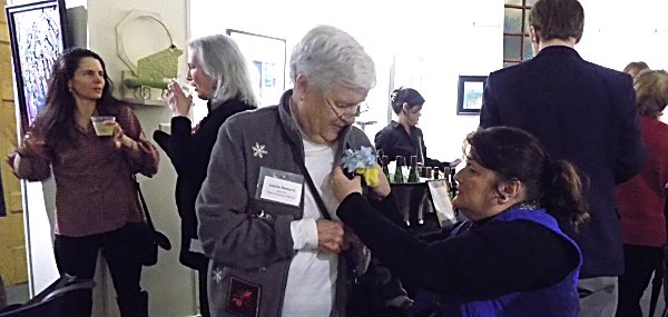 Louise Bement receives a corsage