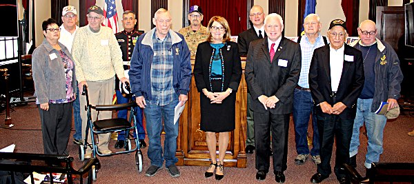 Senator Pam Helming stands with the veterans from Cayuga County and the Town of Lansing who were recognized for their nomination to the New York State Senate Veterans Hall of Fame during a ceremony at Memorial City Hall in Auburn. helming honoringvets
