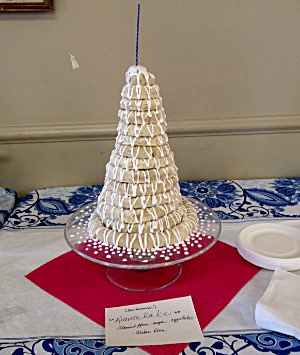 A traditional Danish and Norwegian cake, this kransekake, like all dishes at the Interfaith Community Dinners, is labeled so that people with religious or dietary restrictions can choose among the many dishes-to-pass accordingly Kransekaka at Interfaith Dinner