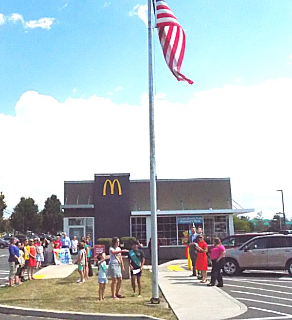 Local Girl Scout Troop 40855 performs a flag ceremony at the grand re-opening of the Triphammer Road McDonald's Lansing McDonald's