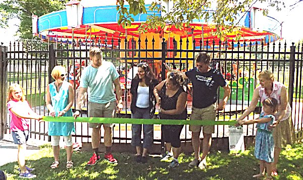 Left to right: Meloney McMurry (Playground Leadership Committee and her daughters), Lucas Raley (Playground Build Coordinator), Diana Riesman (Executive Director Wharton Studio Museum, and Chair, Board of Directors, Friends of Stewart Park), Deborah Mohlenhoff (Common Council and Acting Mayor), Rick Manning (Executive Director, Friends of Stewart Park), Elayne Nicholas (Campaign Manager, Friends of Stewart Park) Stewart Park Carousel