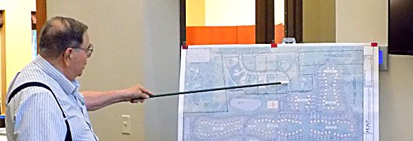 Developer Steven Beer presents a revised Lansing Village Cottages plan to the Board of Trustees Steven Beer