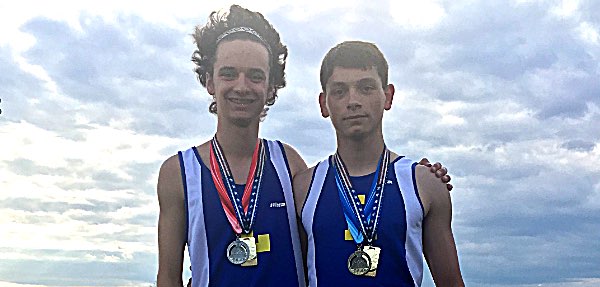 Sam Panzer and Dakota Edwards after setting school record in long jump relay track Sam Dakota Field Fest 2018