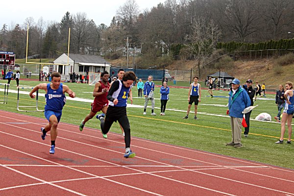 Sam Panzer winning his heat of the 100m dash track panzer