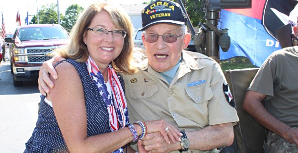 Senator Pam Helming greets Korean War veteran and longtime veterans advocate Ralph Calabrese during the 4th of July parade in Canandaigua in July 2018 helming vets