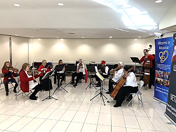 Ritomo a Musica string ensemble greeted the veterans when they arrived in Washington Honor Flight