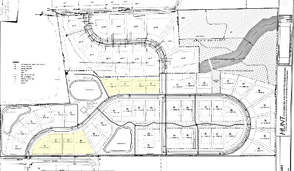 The newest version of the Lansing Village cottages project consists of 34 duplexes and eight owner-occupied (shown in yellow) lots. 5.33 acres in the northeast portion of the property will be designated 'forever wild'. Lansing Village Cottages