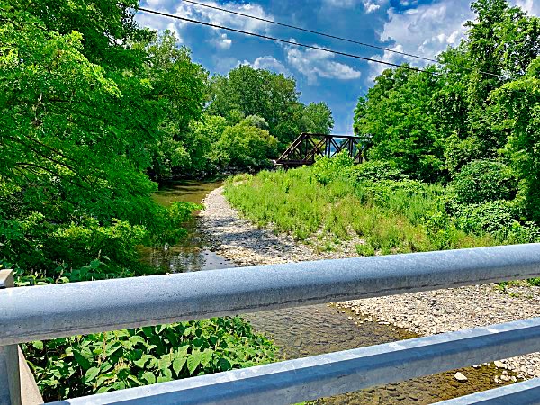 A View from the bridge: Salmon Creek winds from the north, past the old railroad bridge, and squeezing between Myers Park and Salt Point as it flows into Cayuga Lake Nicholas George Bridge